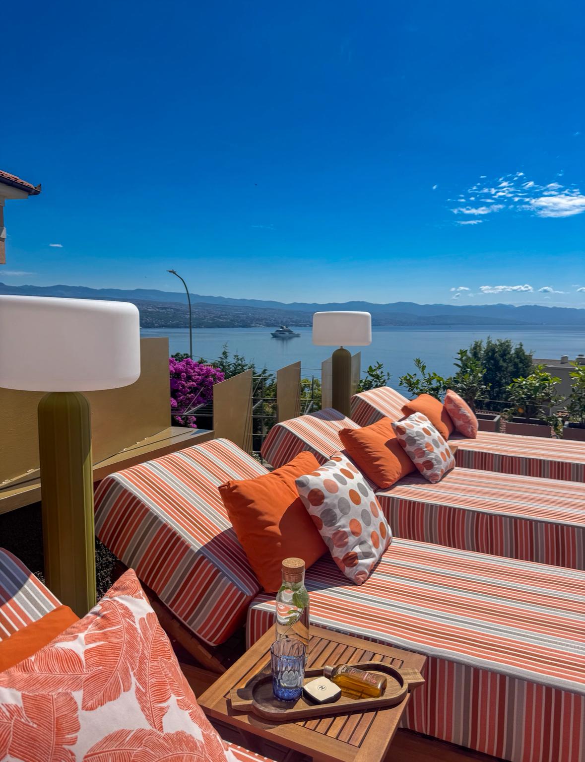 Poolside sun loungers with panoramic Adriatic sea view near Rijeka