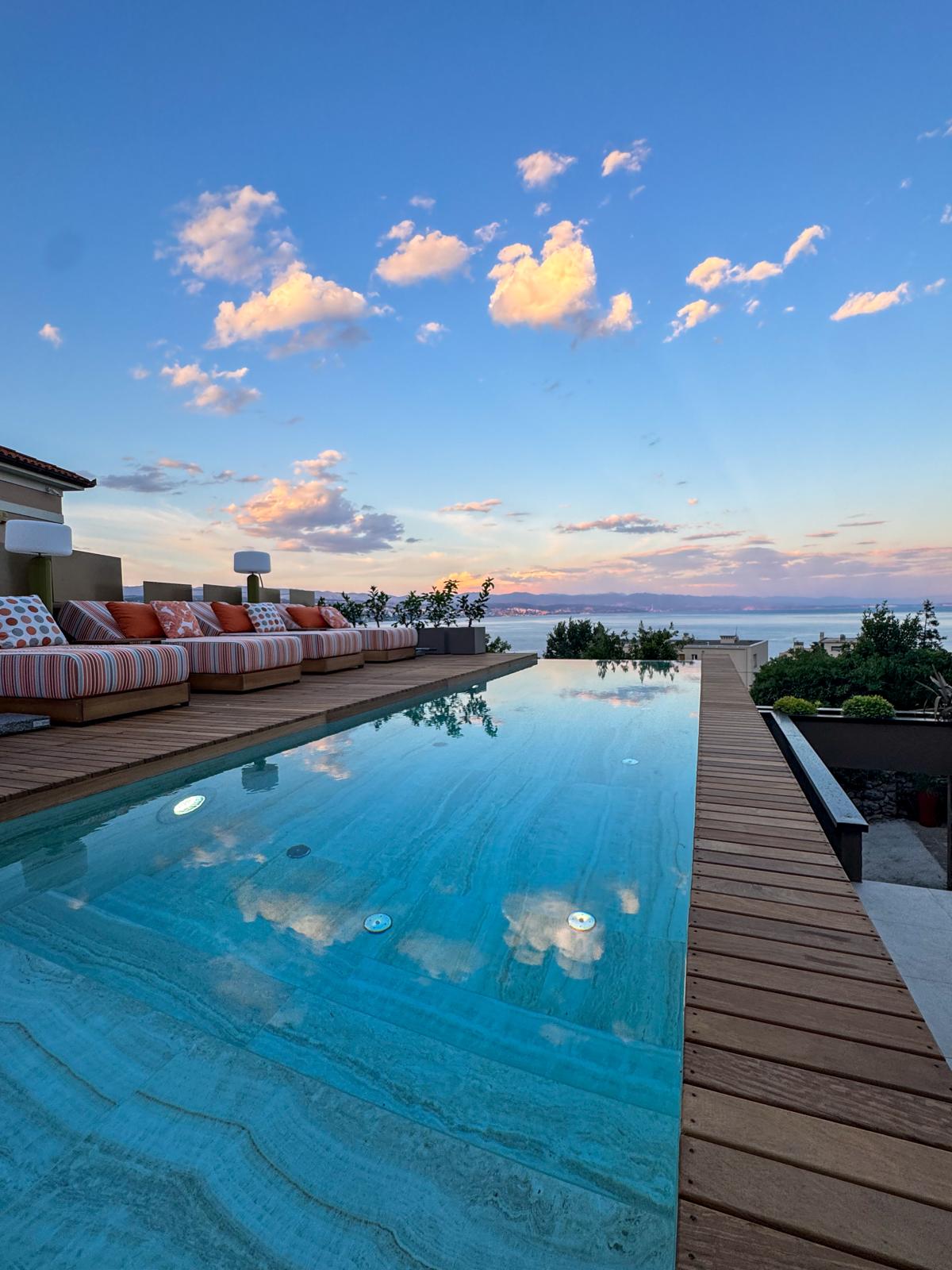 Infinity pool at sunset with Kvarner Bay sea views in Opatija